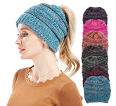 Knitted headband worn by a person with additional headbands displayed in a stack.
