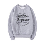 Gray sweatshirt with motivational text and mountain graphic on a white background