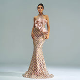 Elegant evening gown with floral details on a plain background