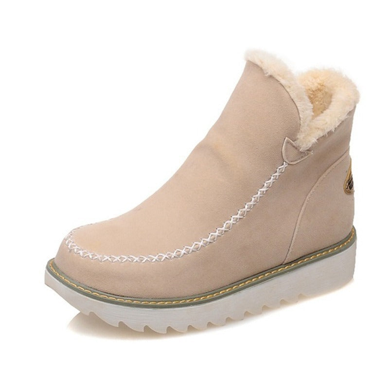 Beige winter boot with fur lining on a white background