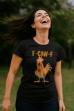 Woman wearing a black t-shirt with a rooster graphic and 'F-CAW-F' text outdoors.