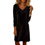 Black dress worn by a model on a white background