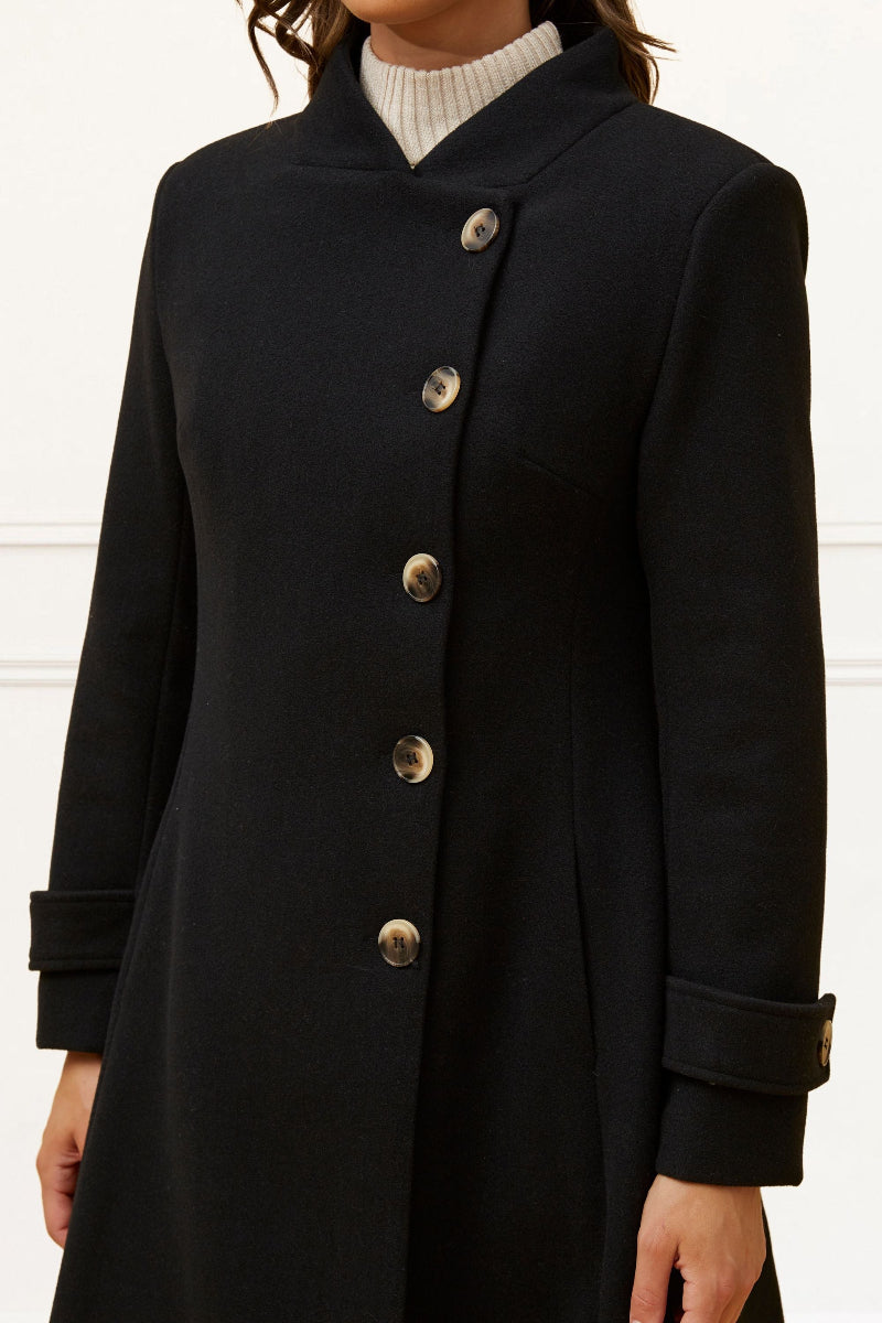 Black coat with silver buttons on a white background