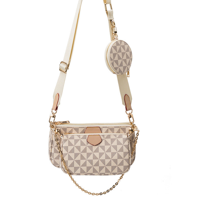 Beige geometric patterned handbag with matching round coin purse on a white background