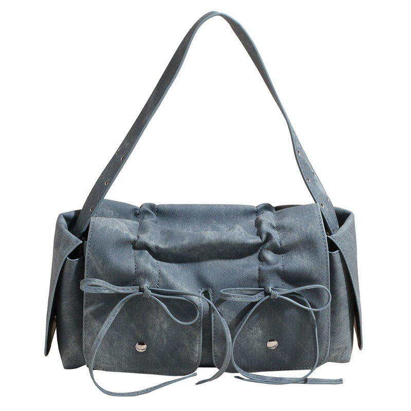 Gray handbag with drawstring details on a white background