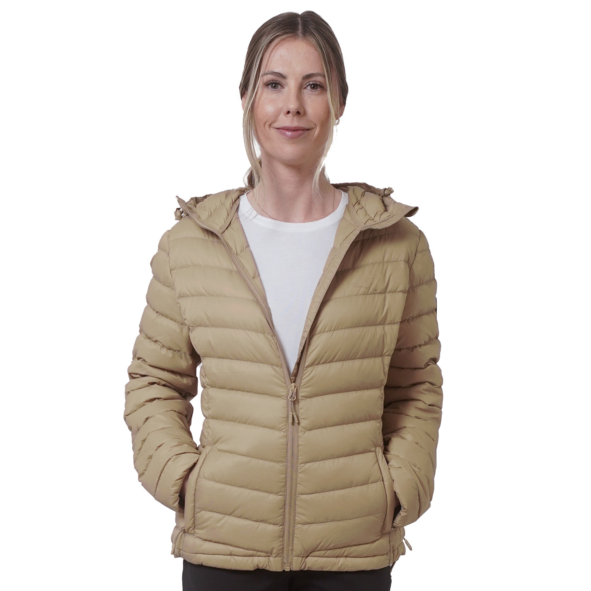 Woman wearing a beige puffer jacket on a white background